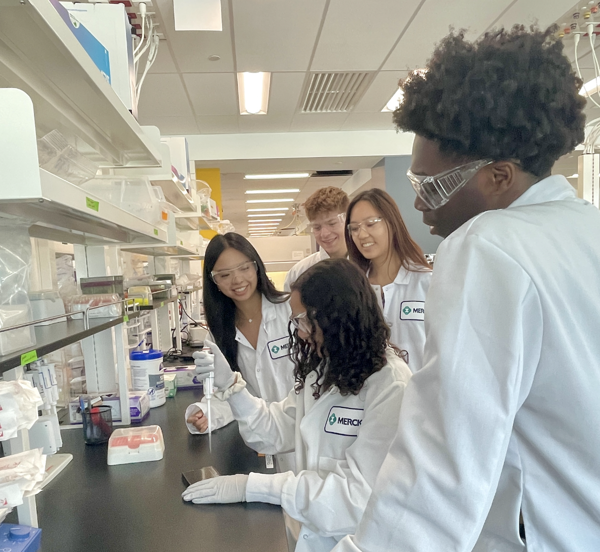 Interns at work in the laboratory at Merck.