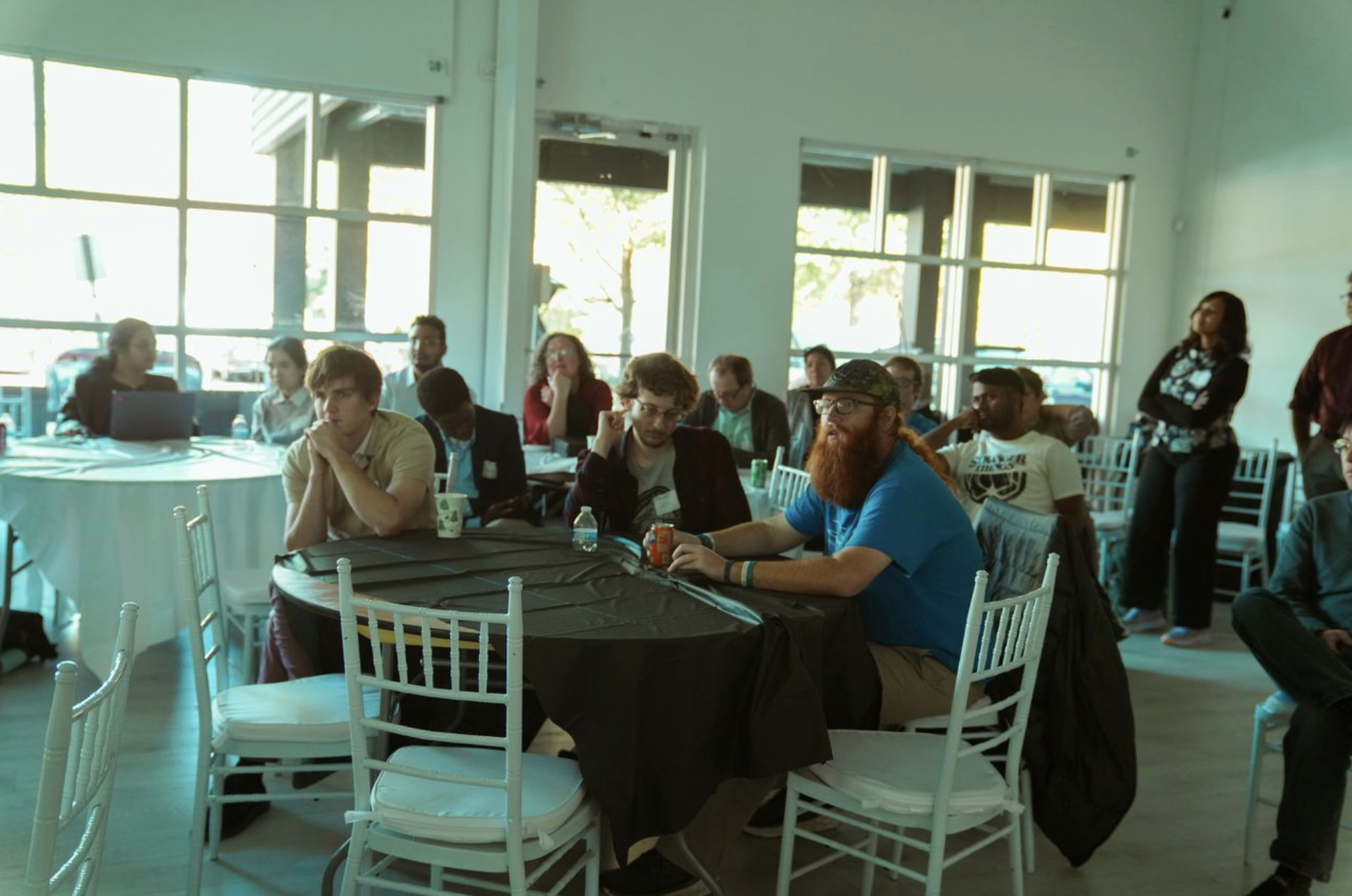 Students and faculty watching an oral presenter.