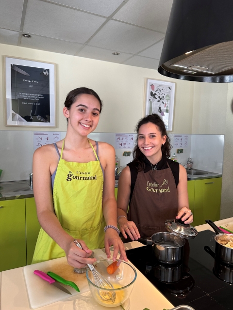 Third-year Biochemistry major Kaya McClincy and third-year Chemical Engineering major Madeline "Maddie"  Murdock put the finishing touches on their entrée.